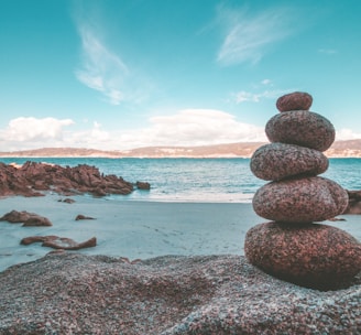 gray rocks on seashore during daytime