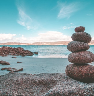 gray rocks on seashore during daytime