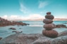 gray rocks on seashore during daytime