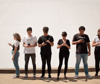 group of people standing on brown floor