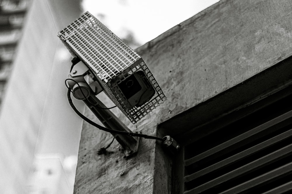 black and white electric device on gray concrete wall