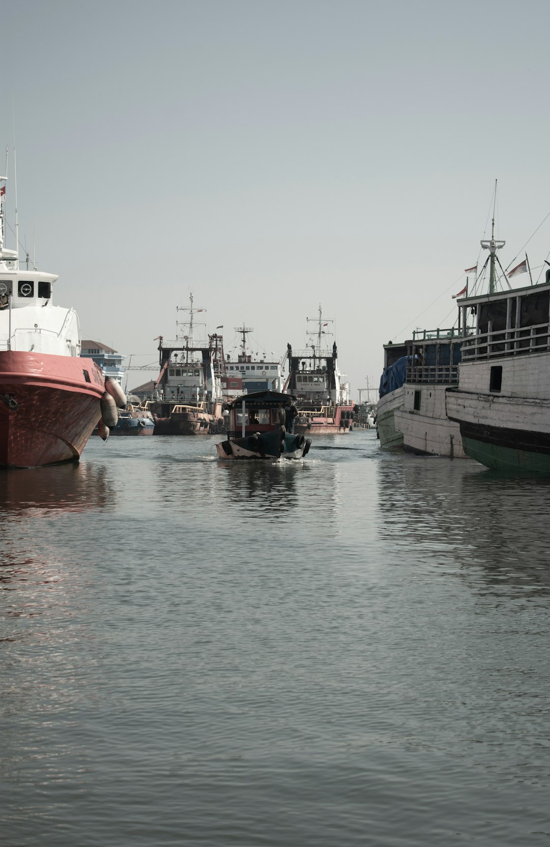 red and white boat on water during daytime