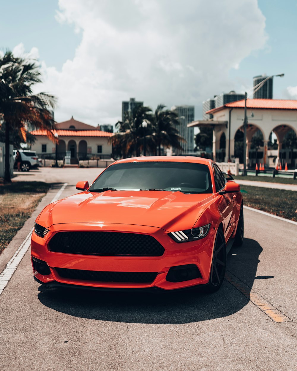 red ferrari sports car on road during daytime