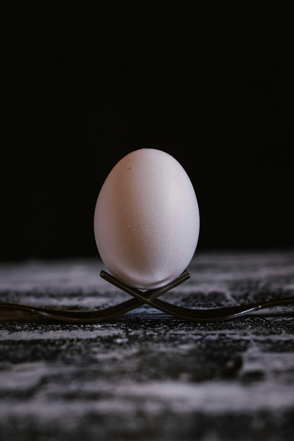 white egg on brown wooden table