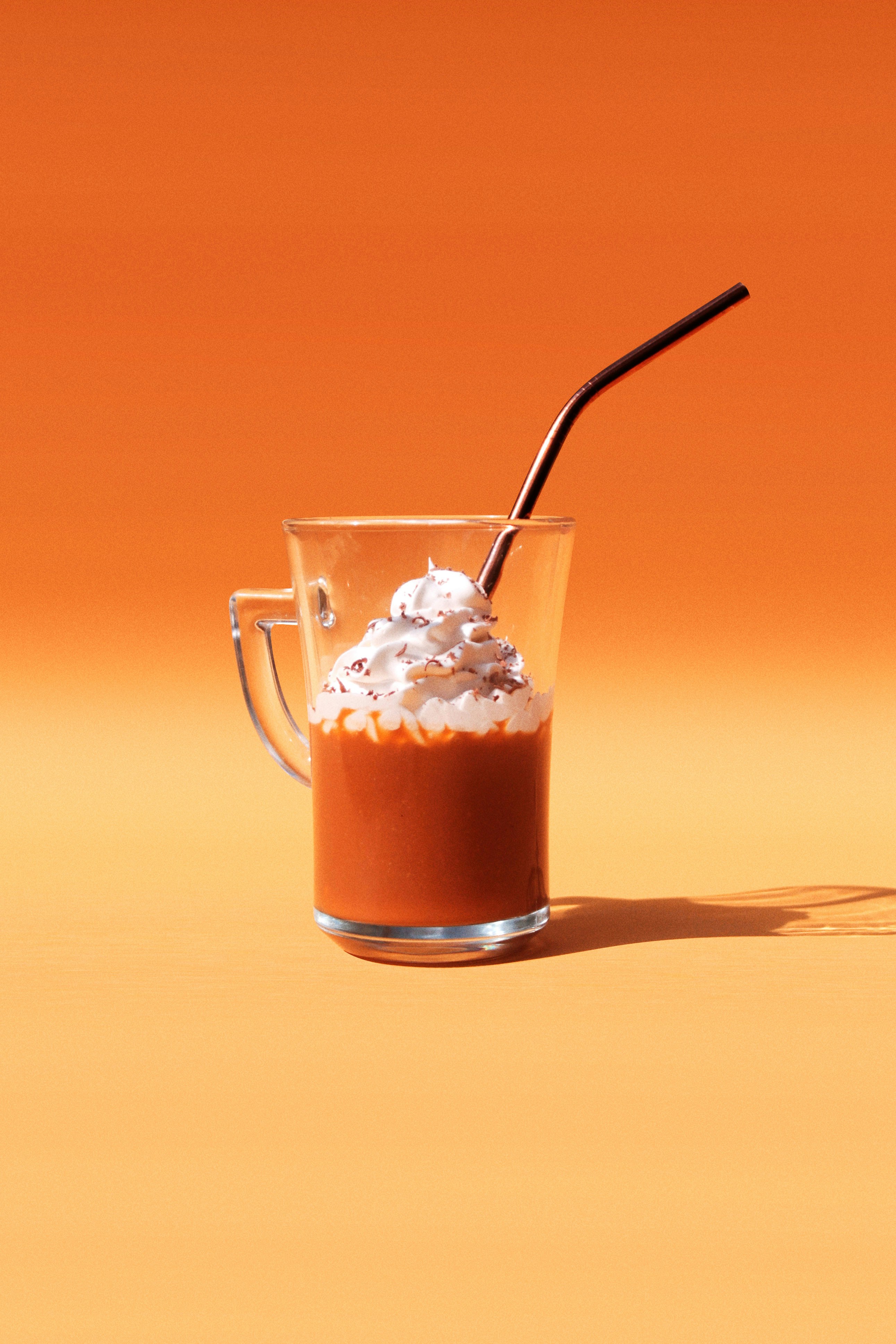 Clear glass mug with brown liquid