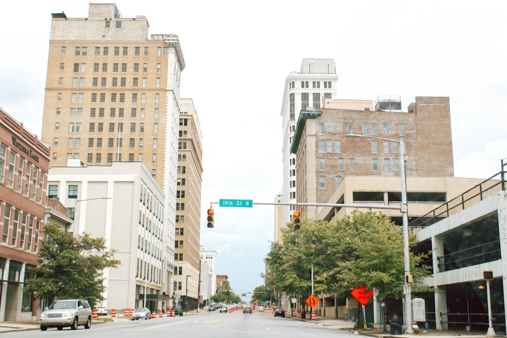 cars on road near buildings during daytime