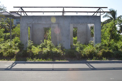 Modern tropical villa under construction with infrastructure groundwork.