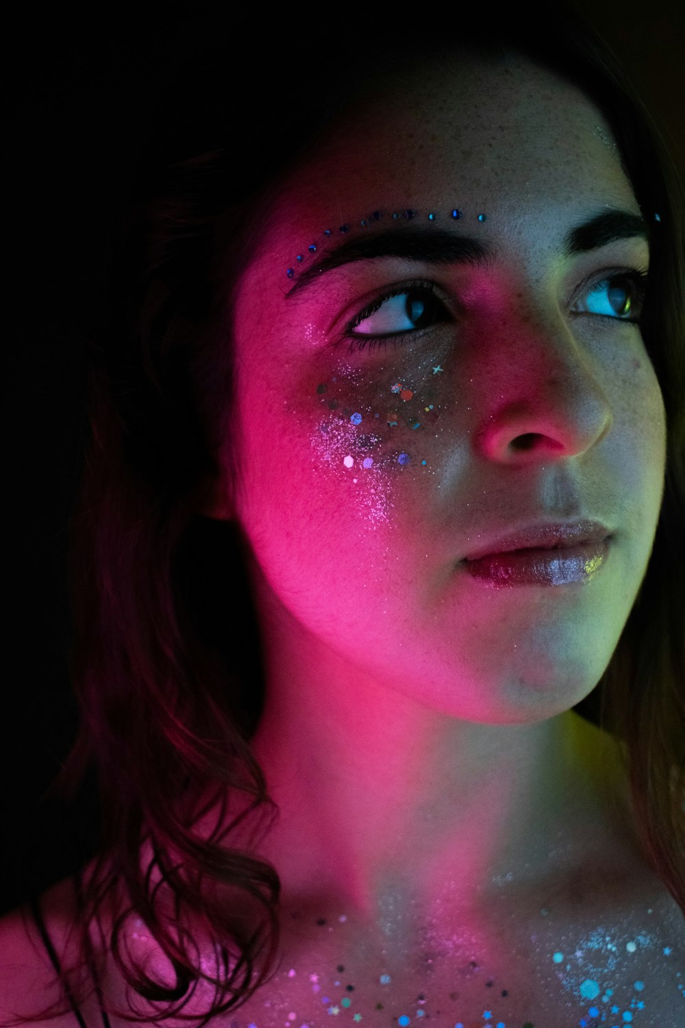 woman with pink lipstick and blue eyes