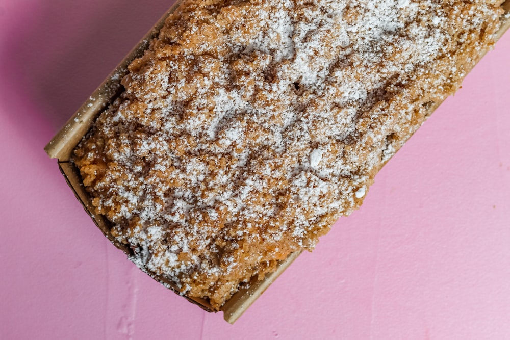 brown and black bread on pink textile