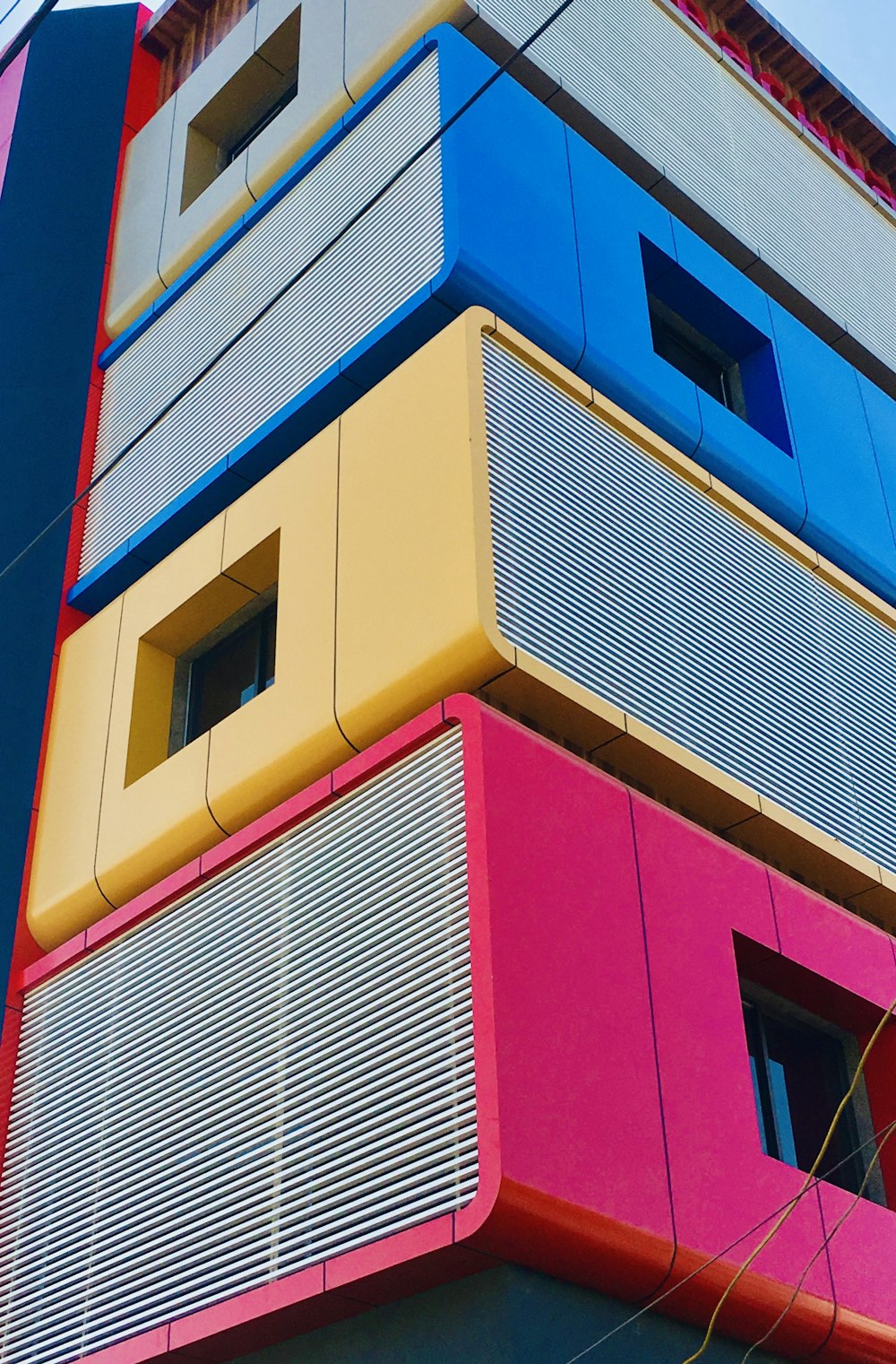 yellow blue and red concrete building