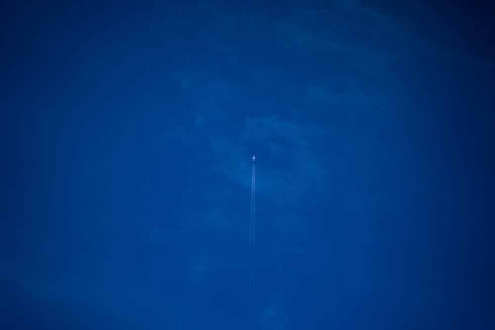 white light bulb on blue sky