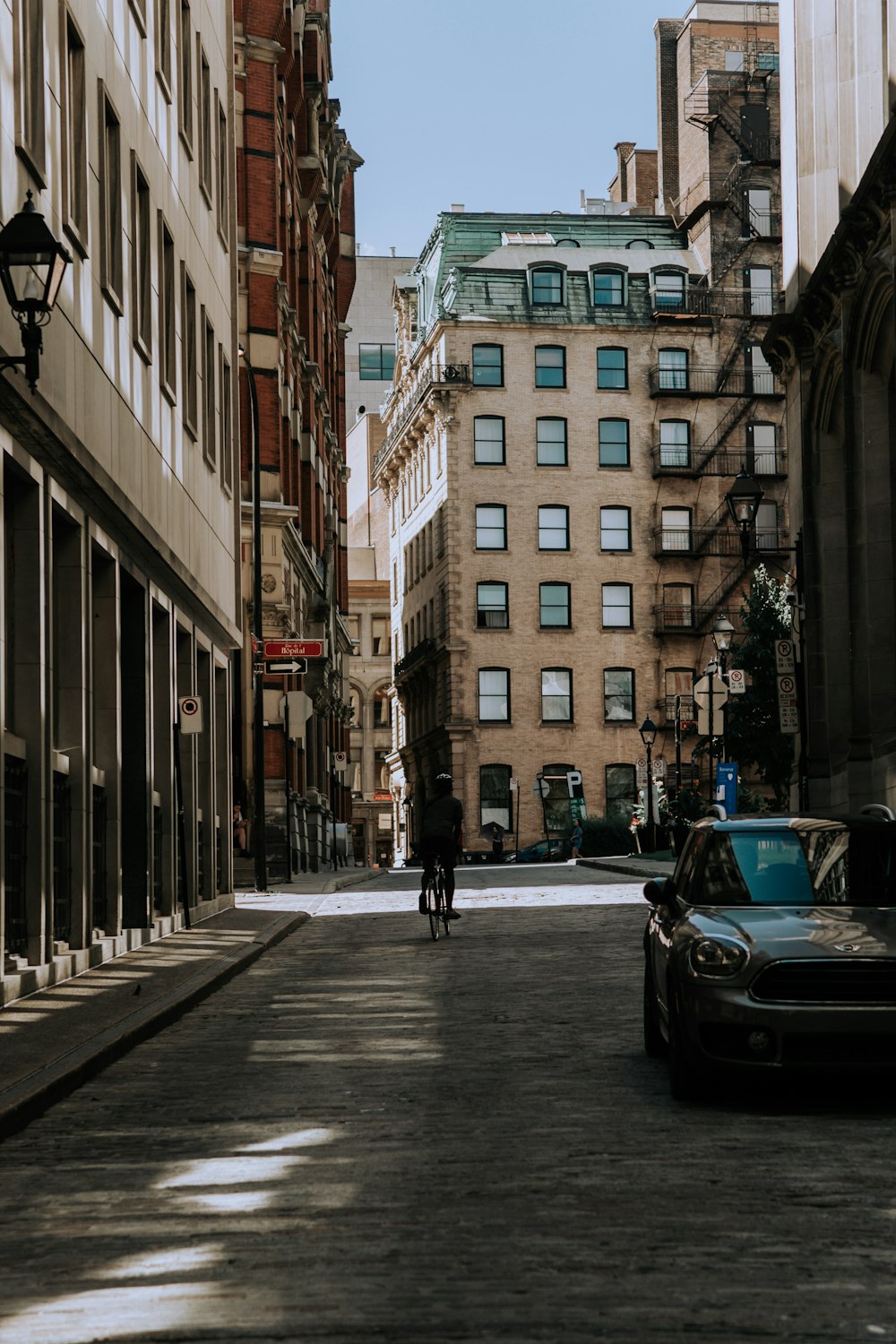 black car on road near building during daytime