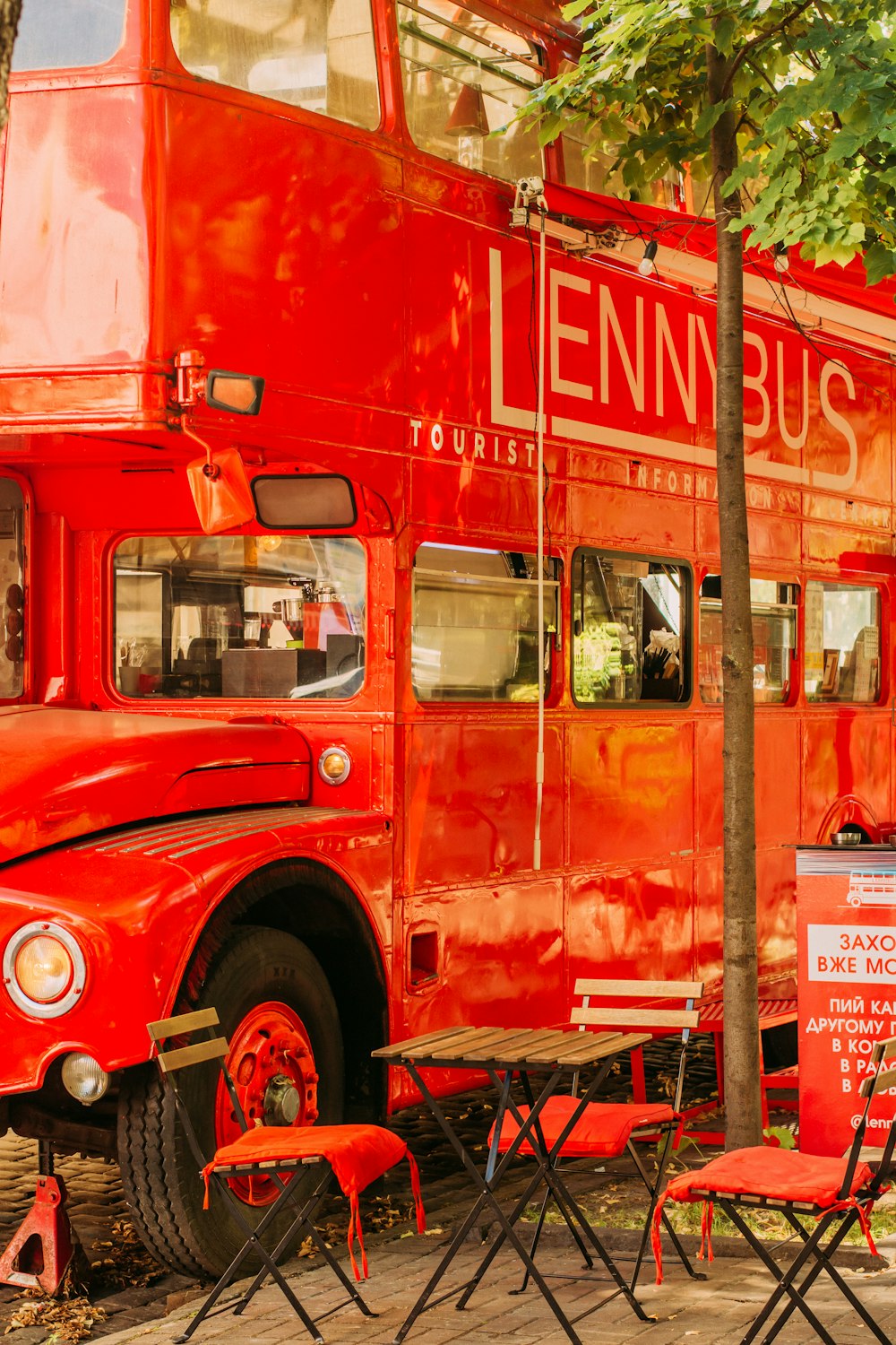 red double decker bus on road during daytime