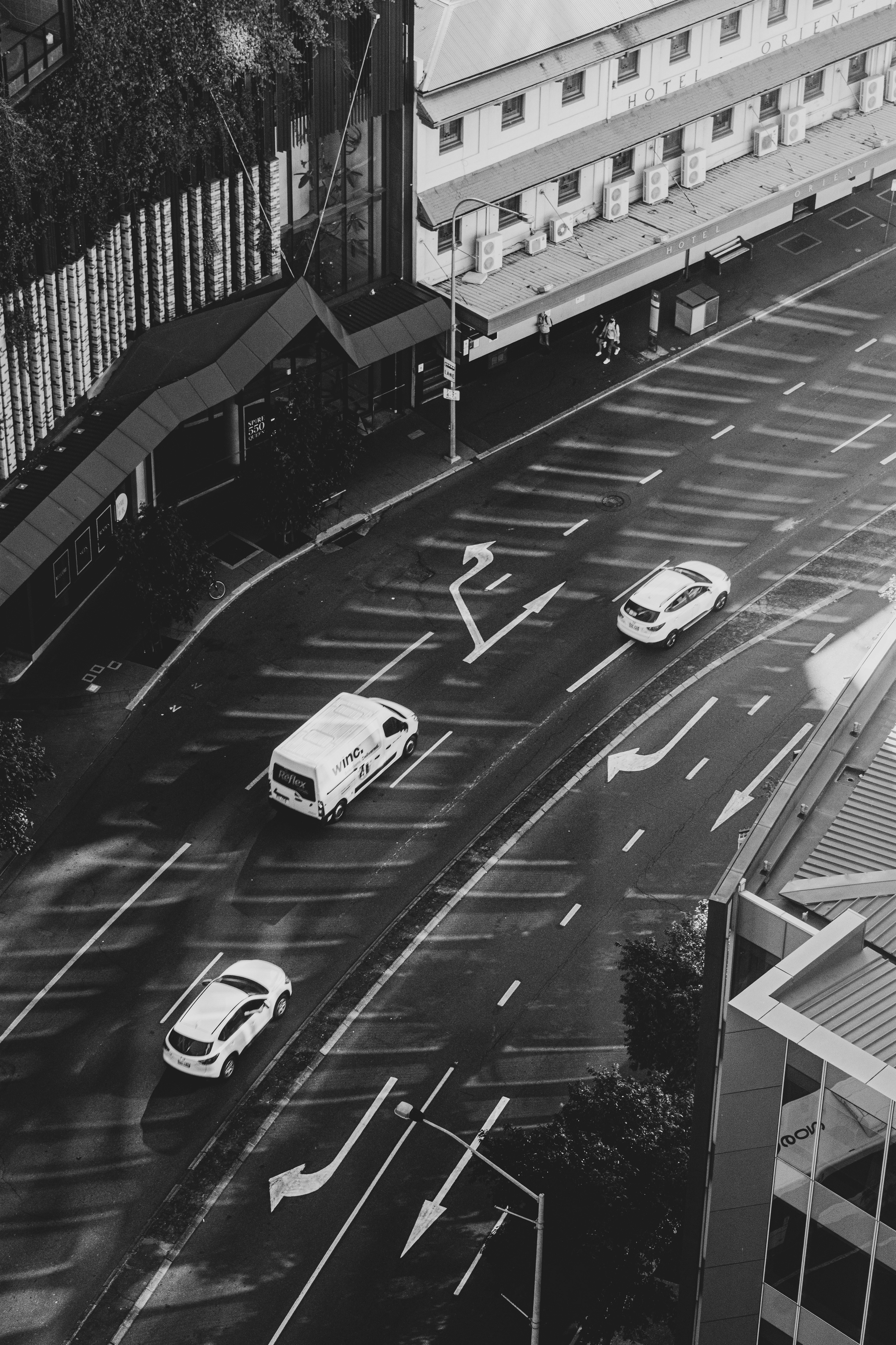 grayscale photo of cars on road