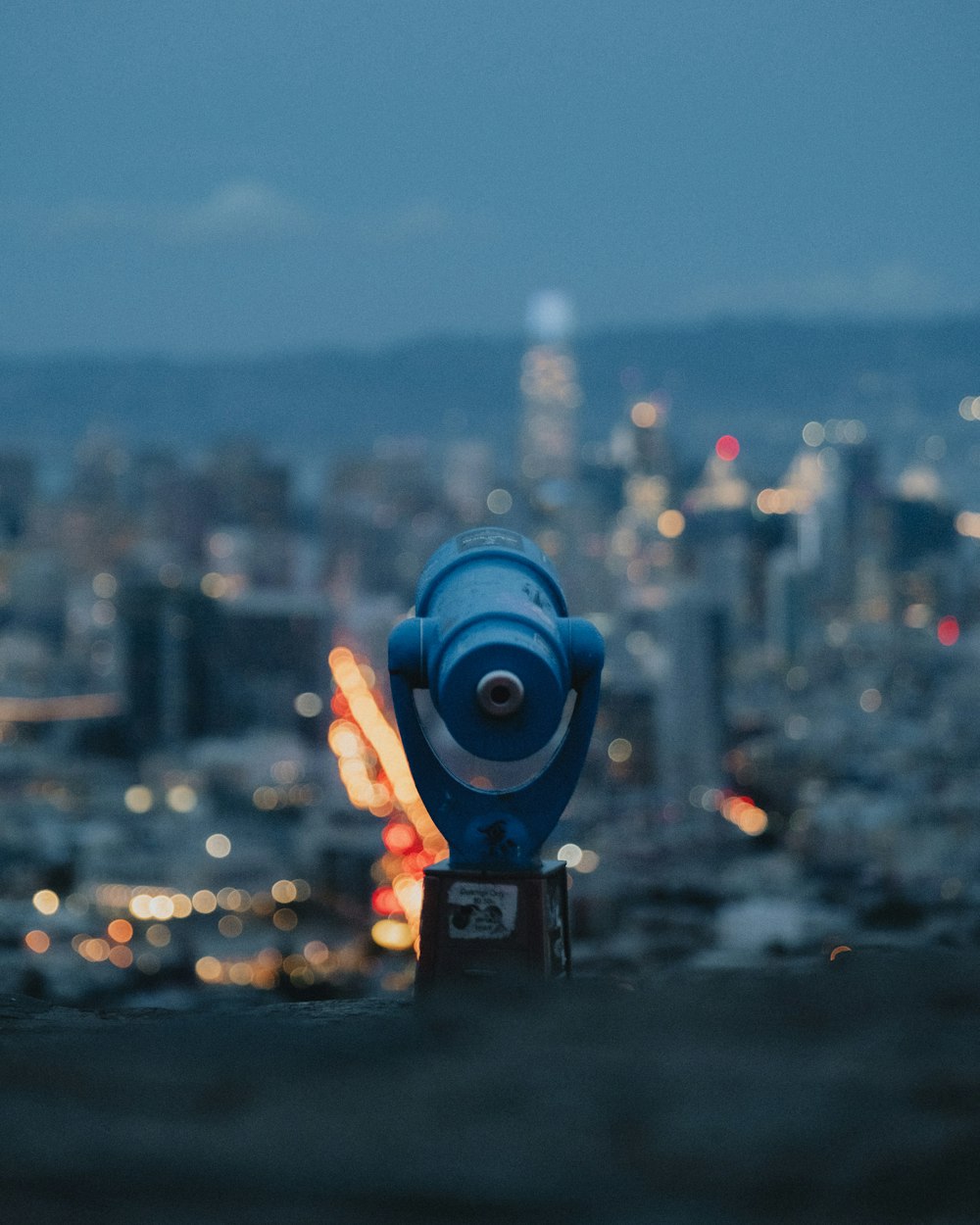 blue and black coin operated binoculars