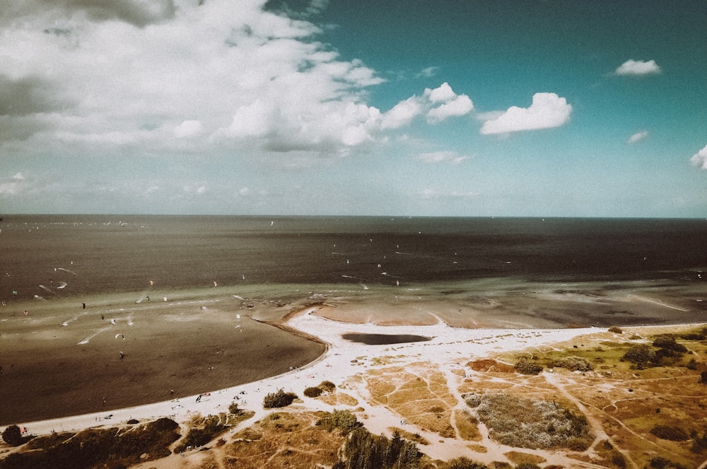 aerial view of a beach under cloudy sky