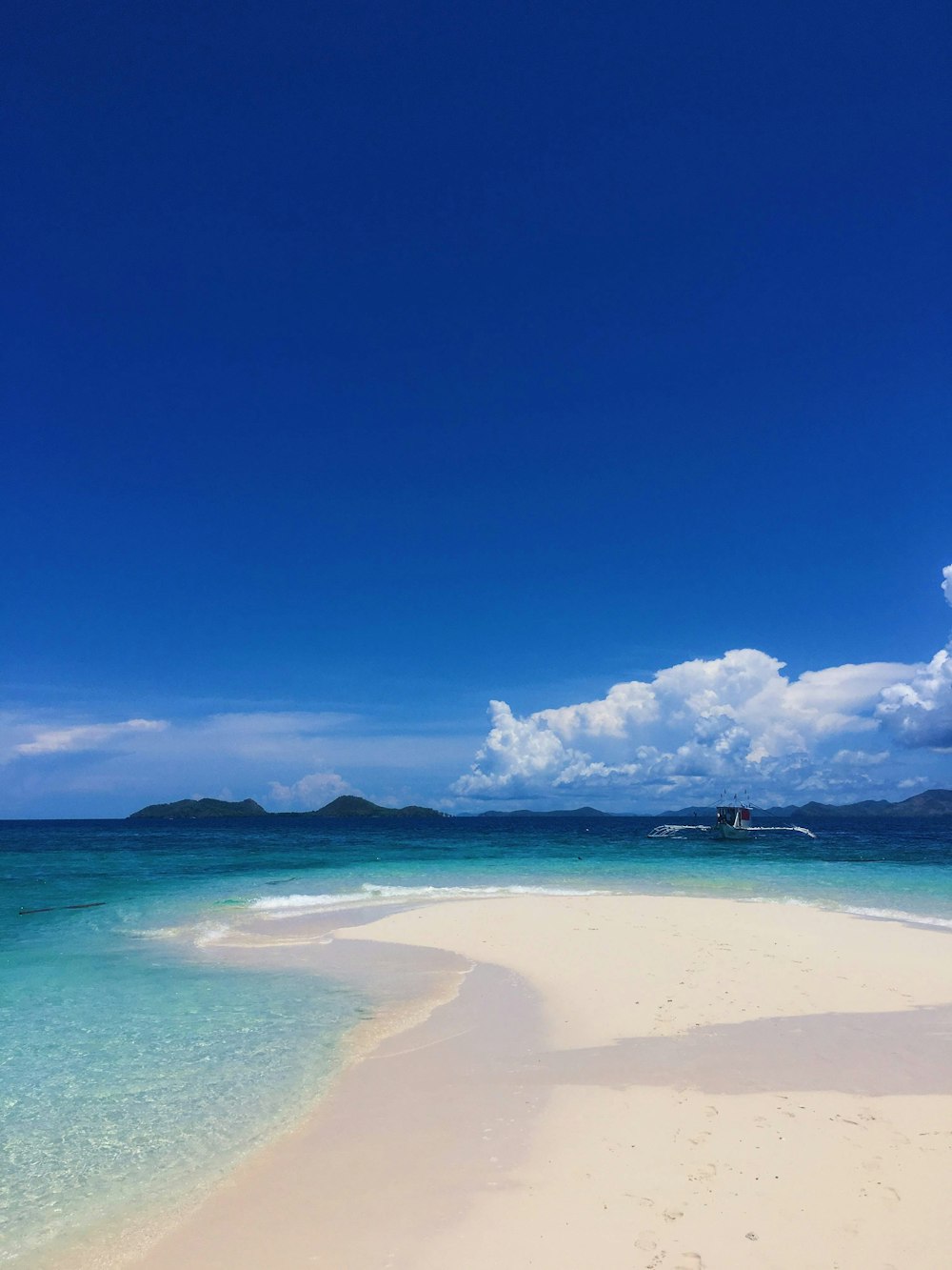 white clouds over blue sea