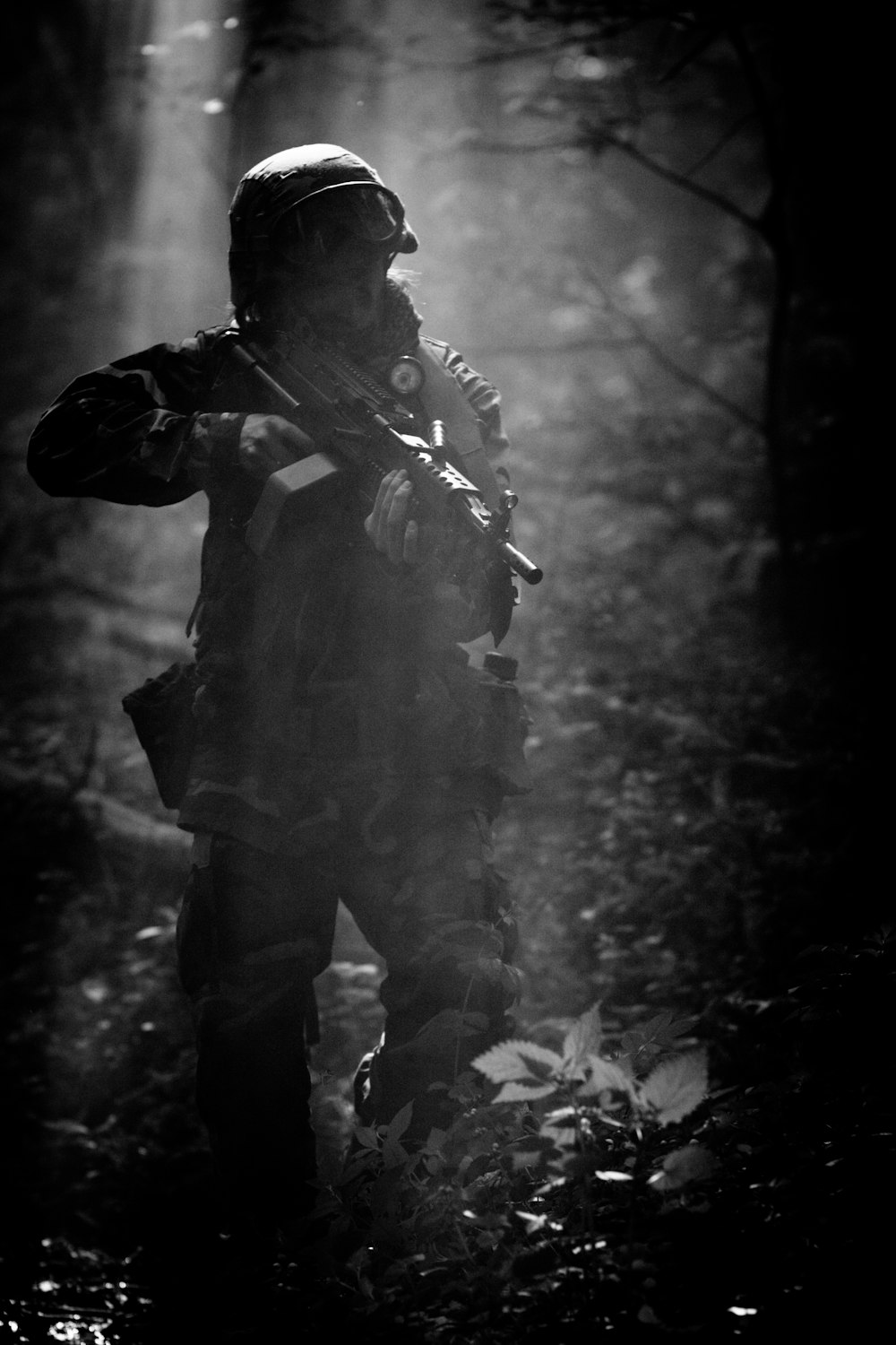 grayscale photo of man in camouflage uniform