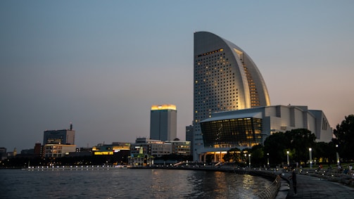 Jeddah’s waterfront district with modern buildings reflecting the sunset, symbolizing growth and opportunity.