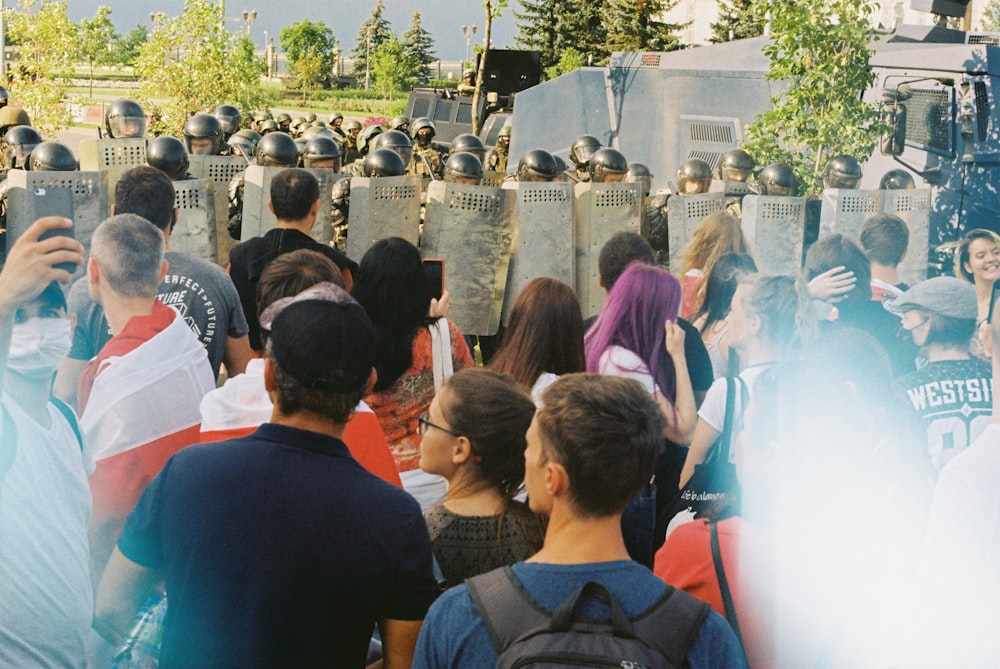 people standing in front of fountain during daytime