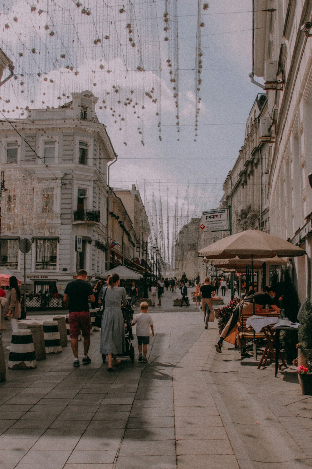 people sitting on chair under umbrella during daytime