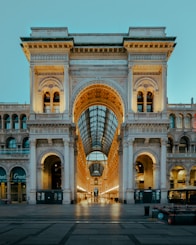 people walking on street near white concrete building during daytime