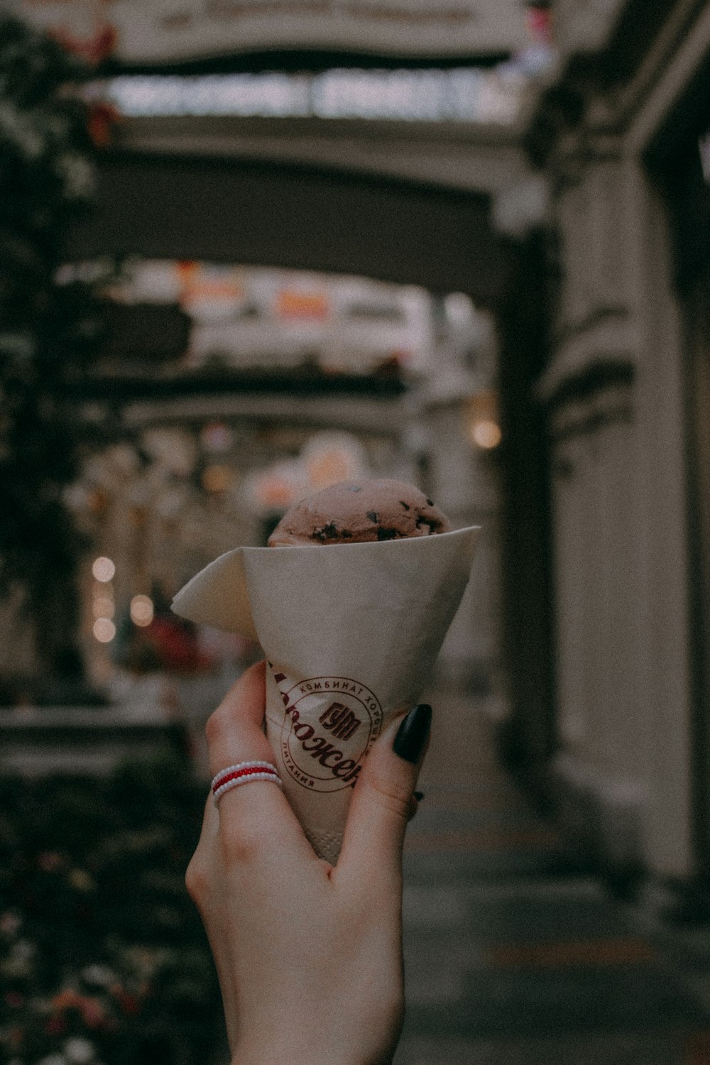 person holding ice cream cone