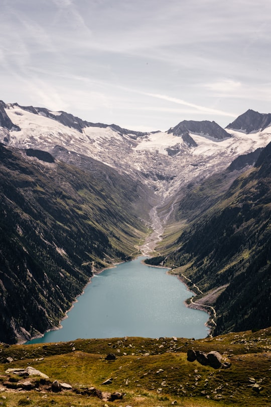 lake in the middle of mountains in Wasserkraftwerke im Zillertal Austria