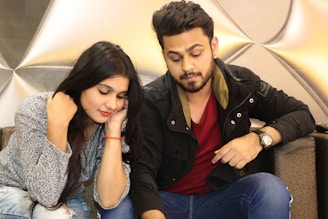 A confident man engaging in a meaningful conversation with a woman, illustrating genuine connection.