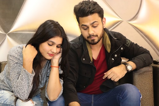 A confident man engaging in a meaningful conversation with a woman, illustrating genuine connection.