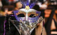 purple and white masquerade mask