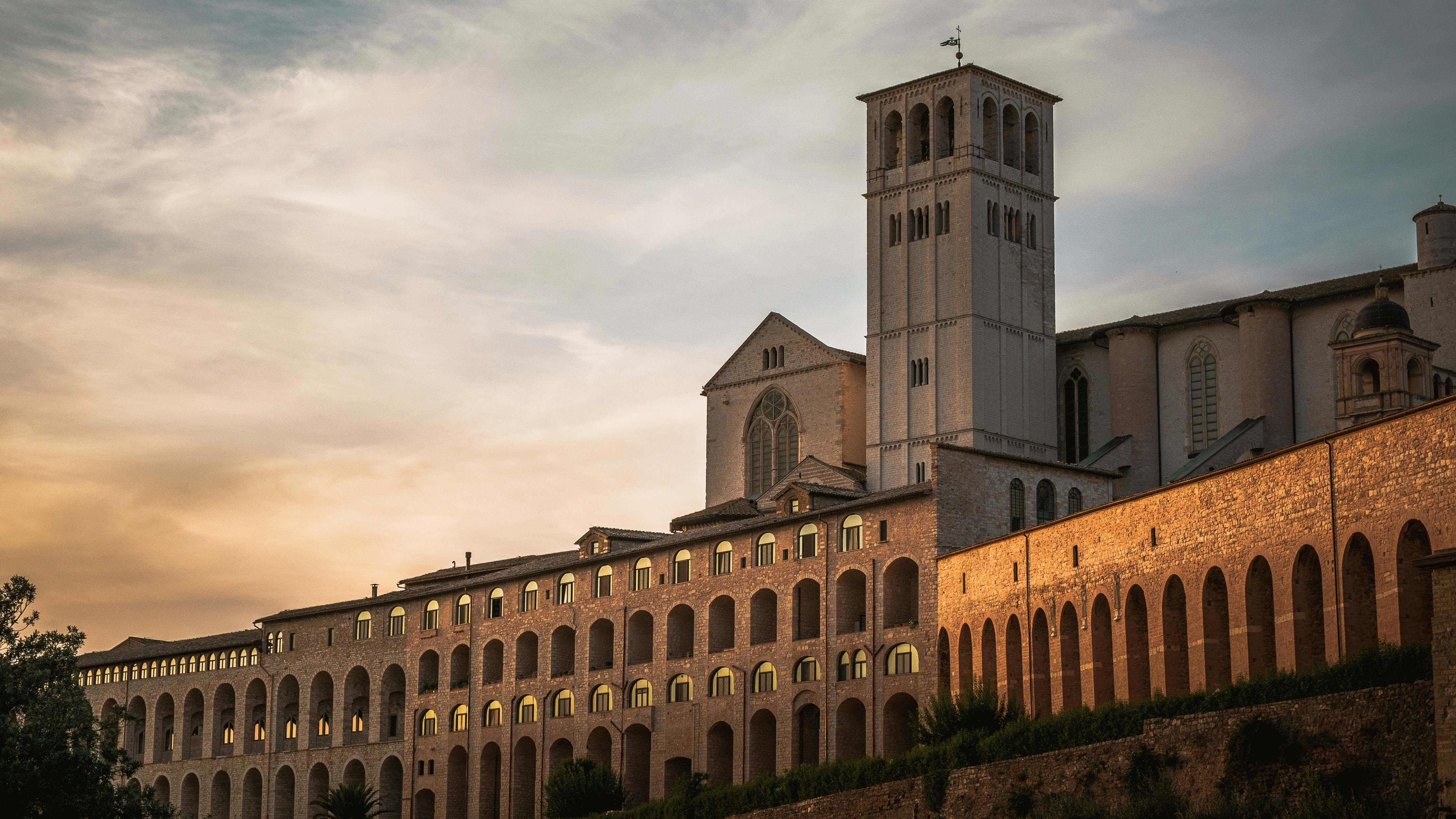 San Francesco's church in Assisi, Italy, during the sunset. Historical building.