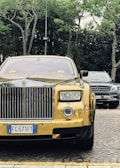 A stunning Rolls Royce parked elegantly against a city skyline.