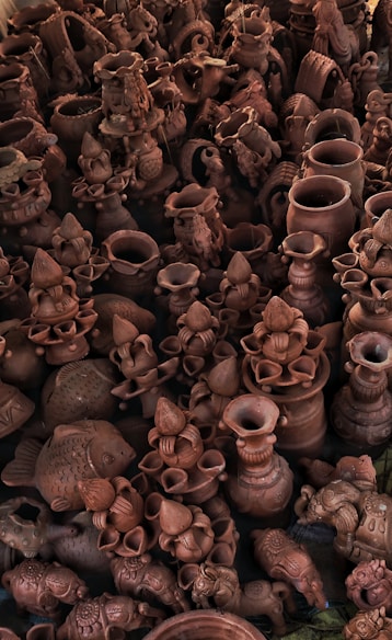 brown ceramic vases on brown wooden table
