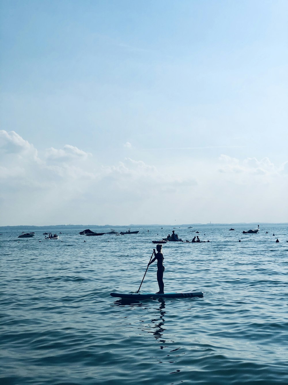 person riding on boat on sea during daytime