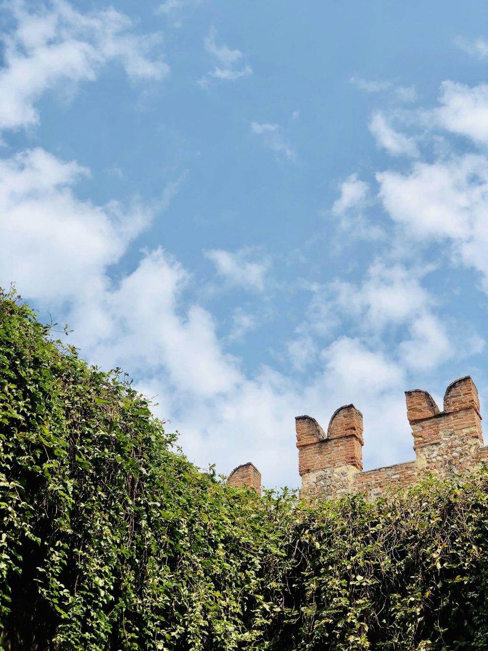 brown brick building under blue sky