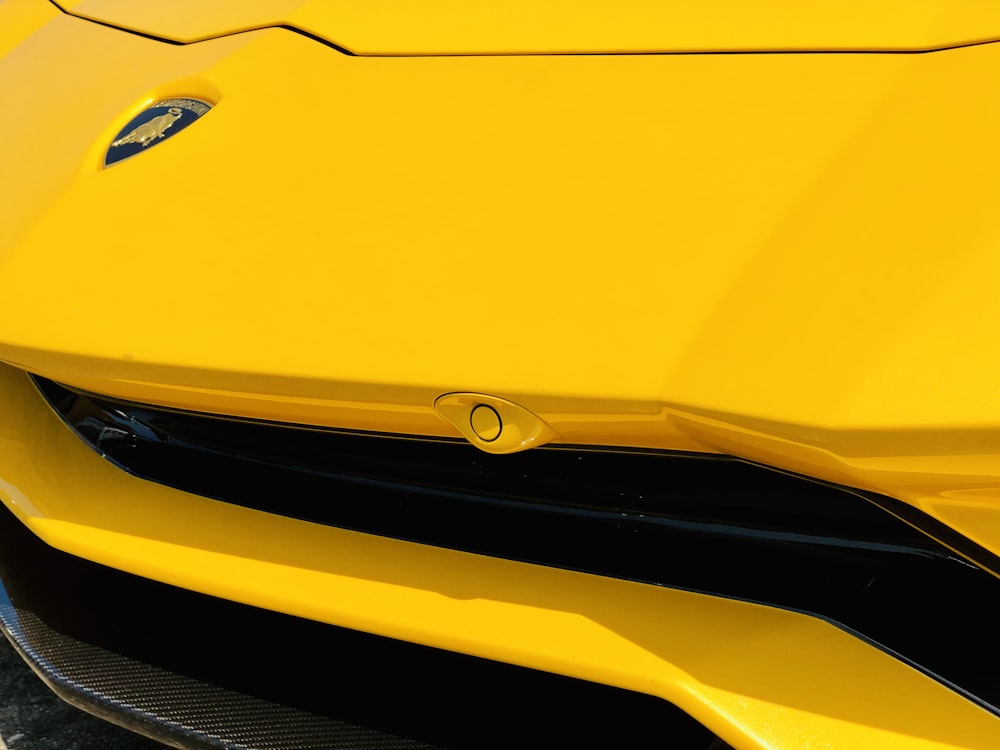 yellow bmw car in close up photography
