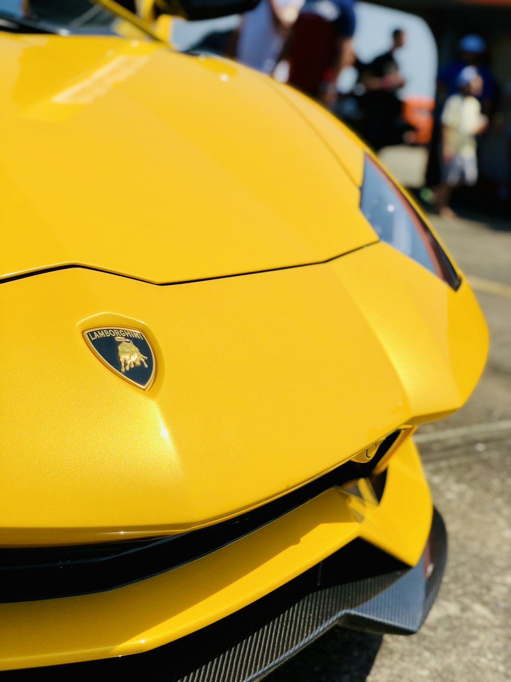 yellow porsche 911 parked on street during daytime