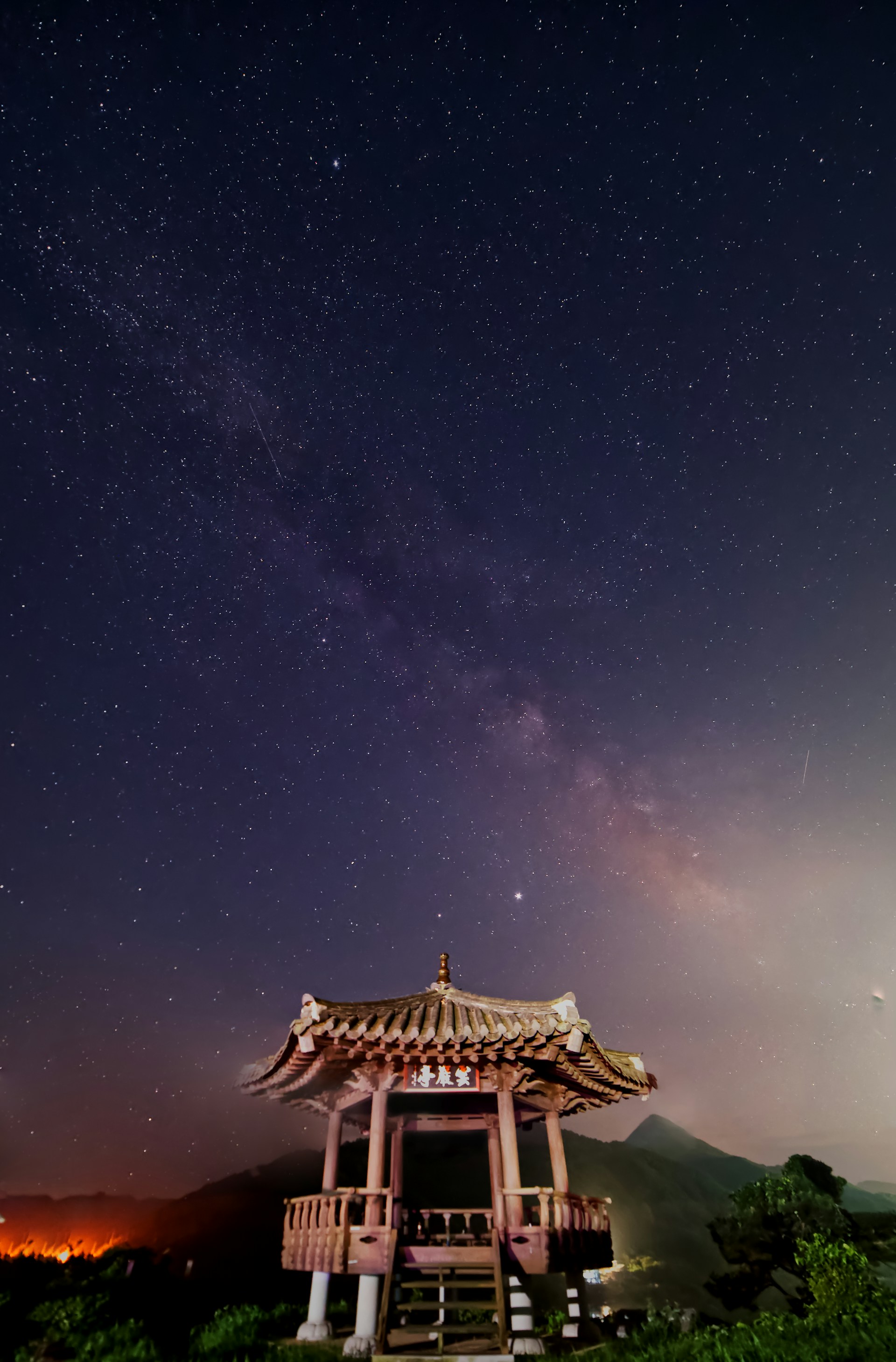 brown and white temple under starry night