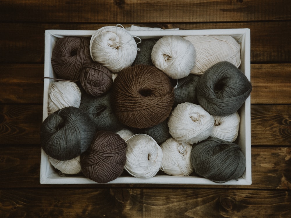 brown and white yarn ball lot