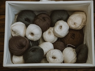 brown and white yarn rolls