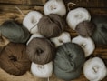 brown and white yarn rolls