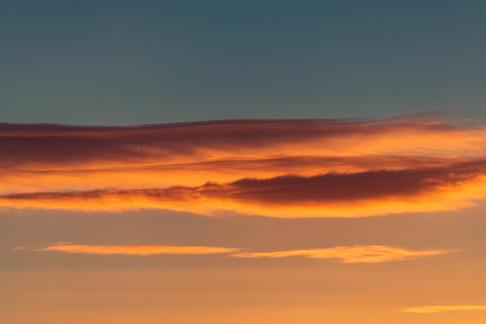 orange and blue sky during sunset