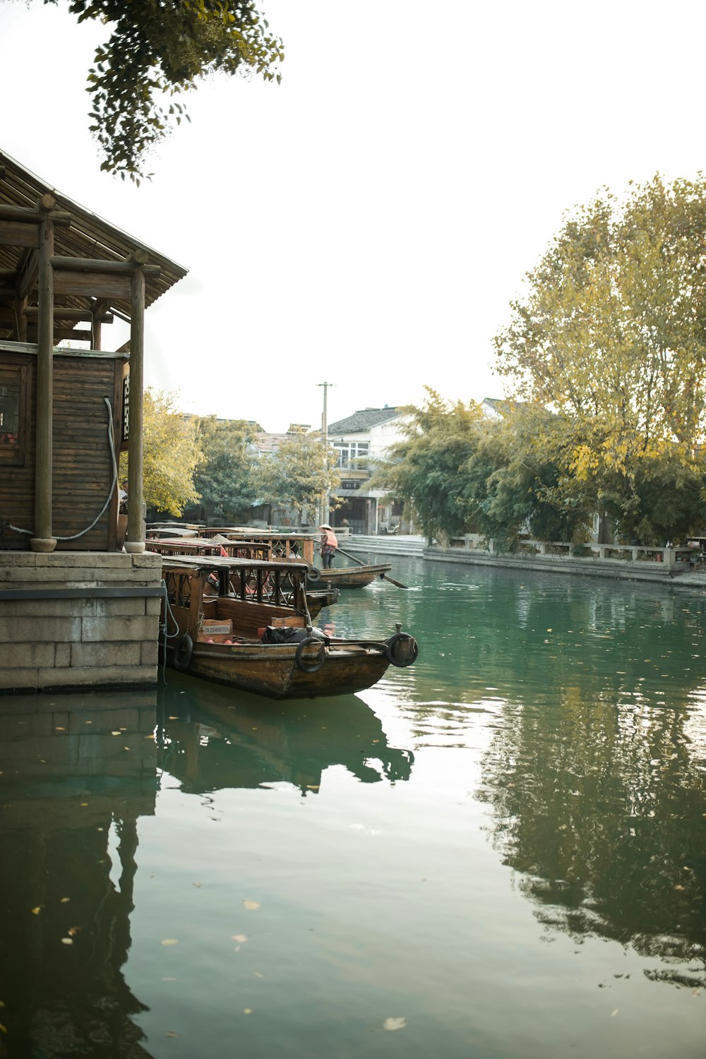 brown wooden boat on river during daytime