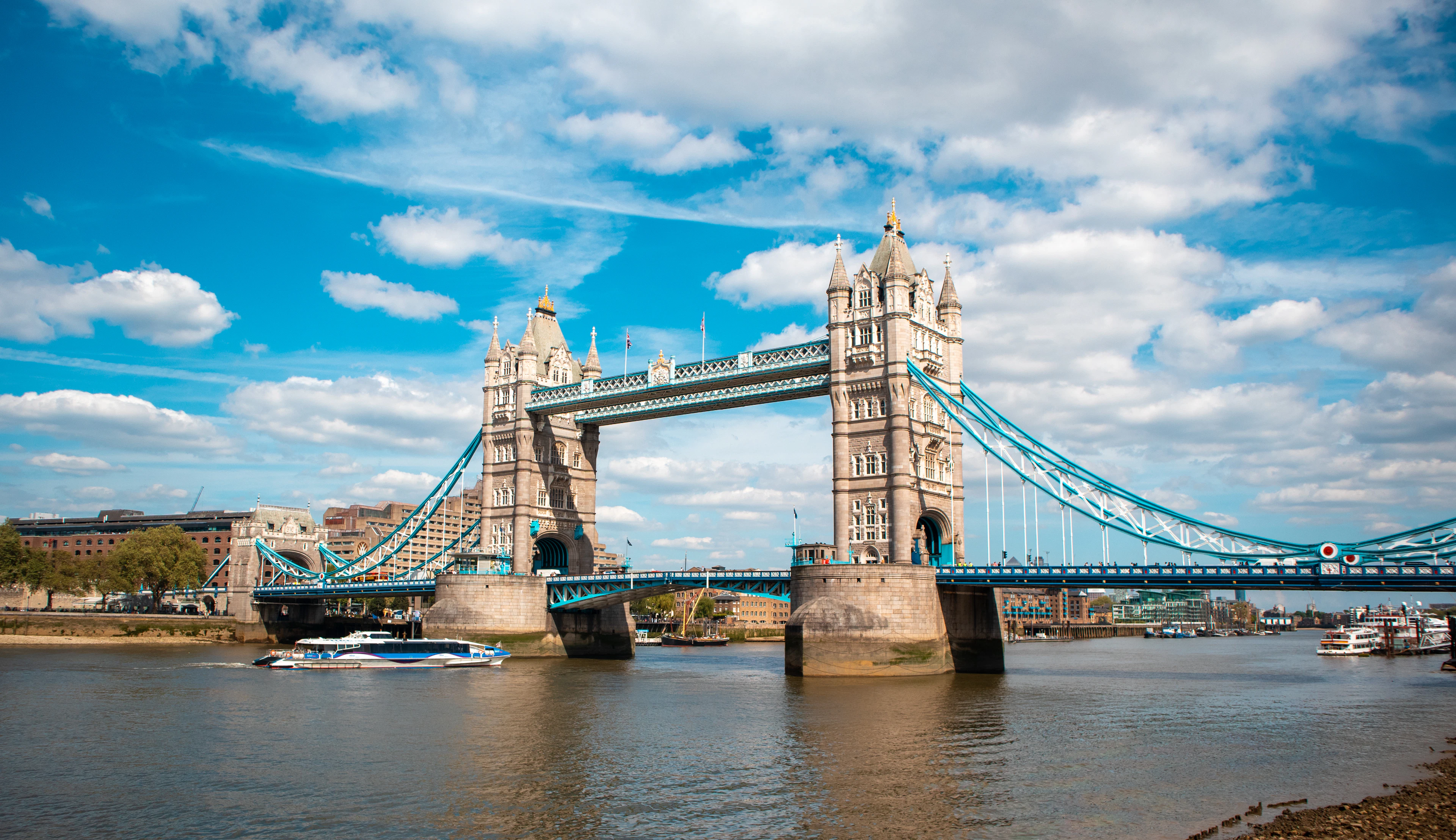 Tower Bridge from the Thames, both towers and the raised walkways spanning the river
