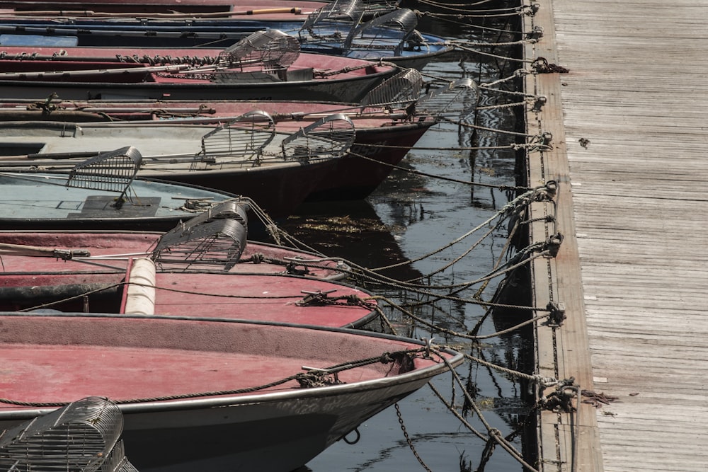 red and white boat on water during daytime