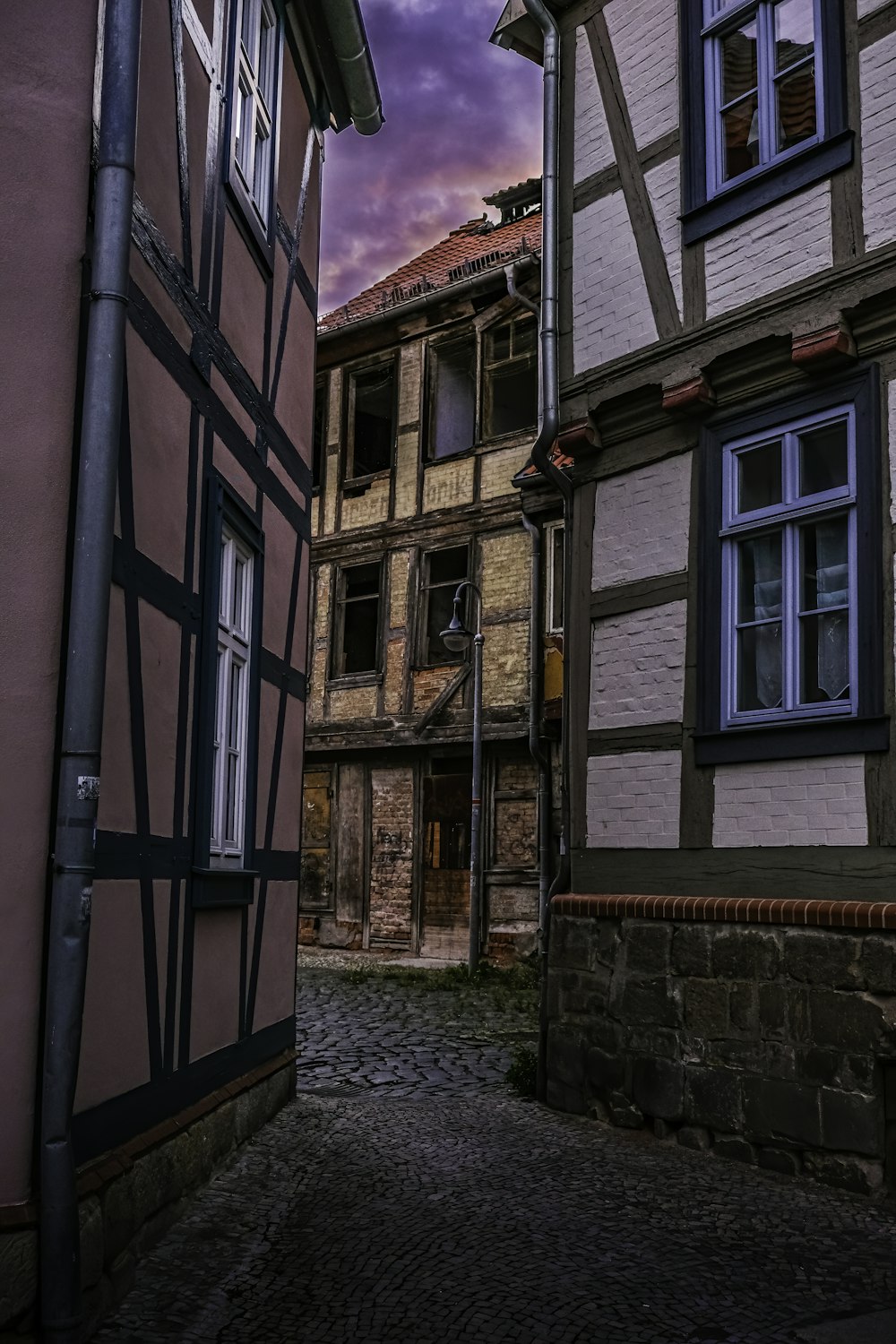 a street with old buildings and a clock tower