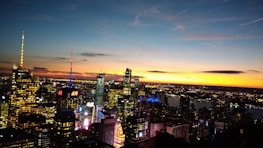A vibrant city skyline at dusk, symbolizing the entertainment industry.