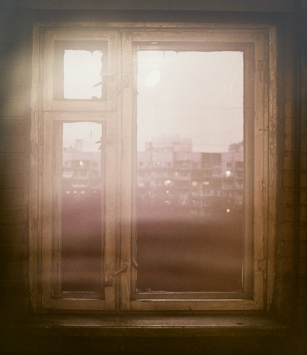 brown wooden framed glass window