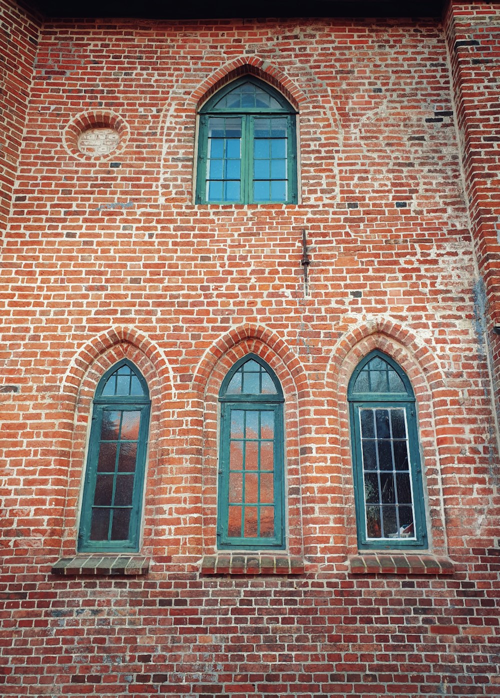 brown brick building with windows